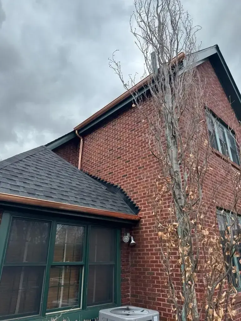 Custom half round copper gutters and twisted downspouts — Chicago, IL — photo 2