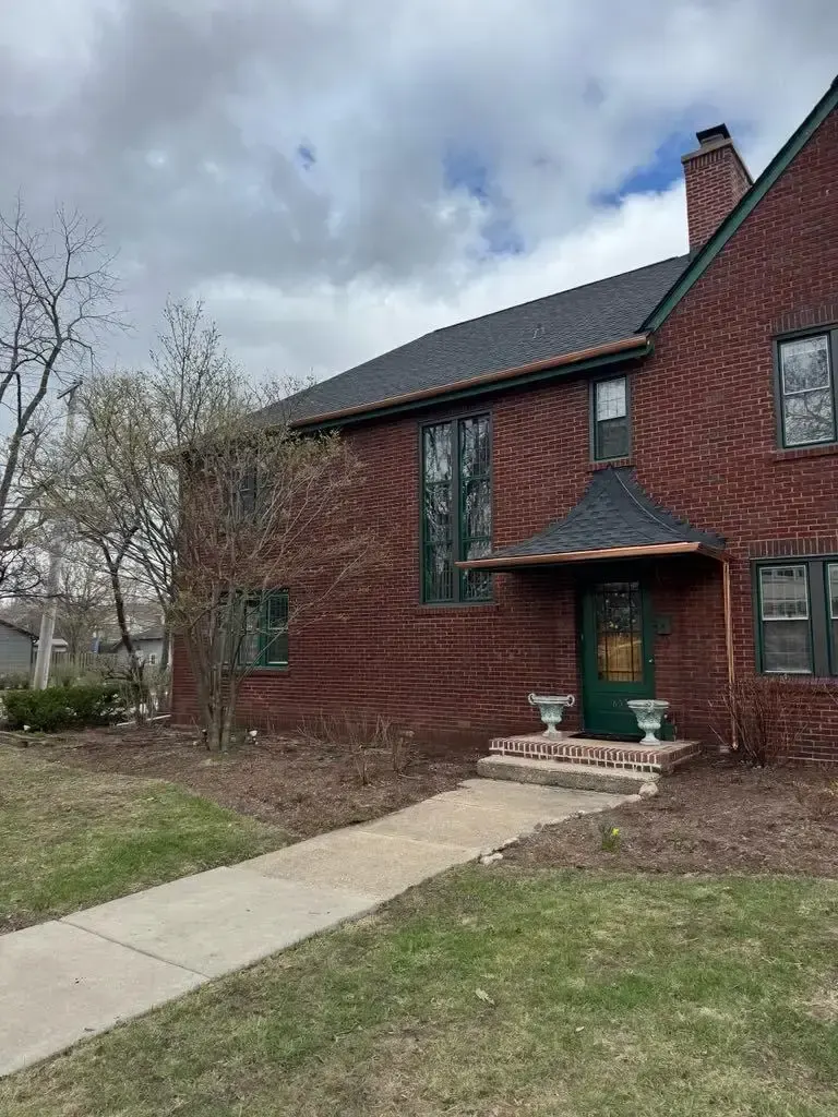 Custom half round copper gutters and twisted downspouts — Chicago, IL — photo 3