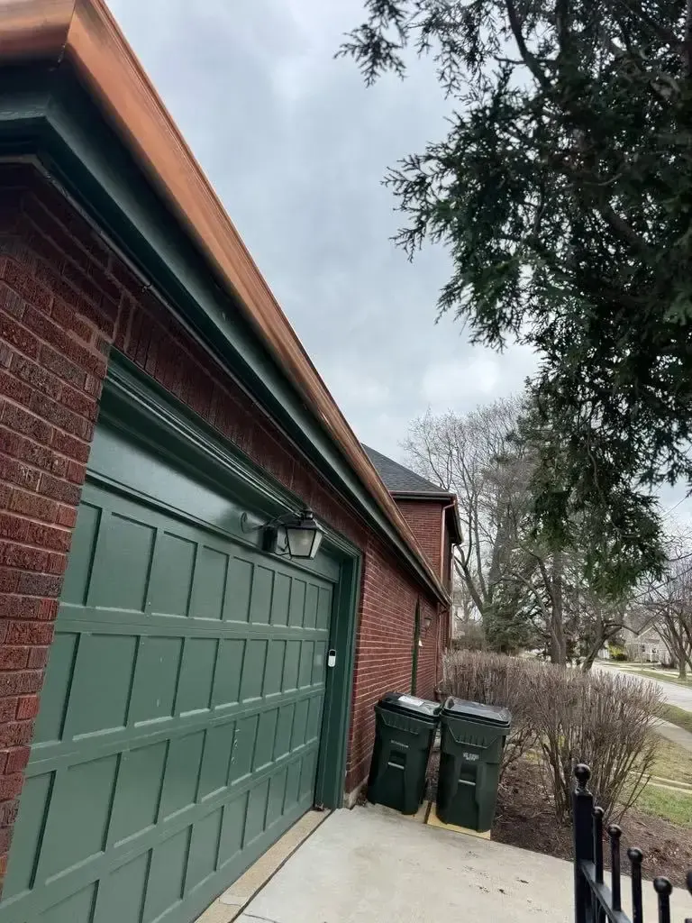 Custom half round copper gutters and twisted downspouts — Chicago, IL — photo 5