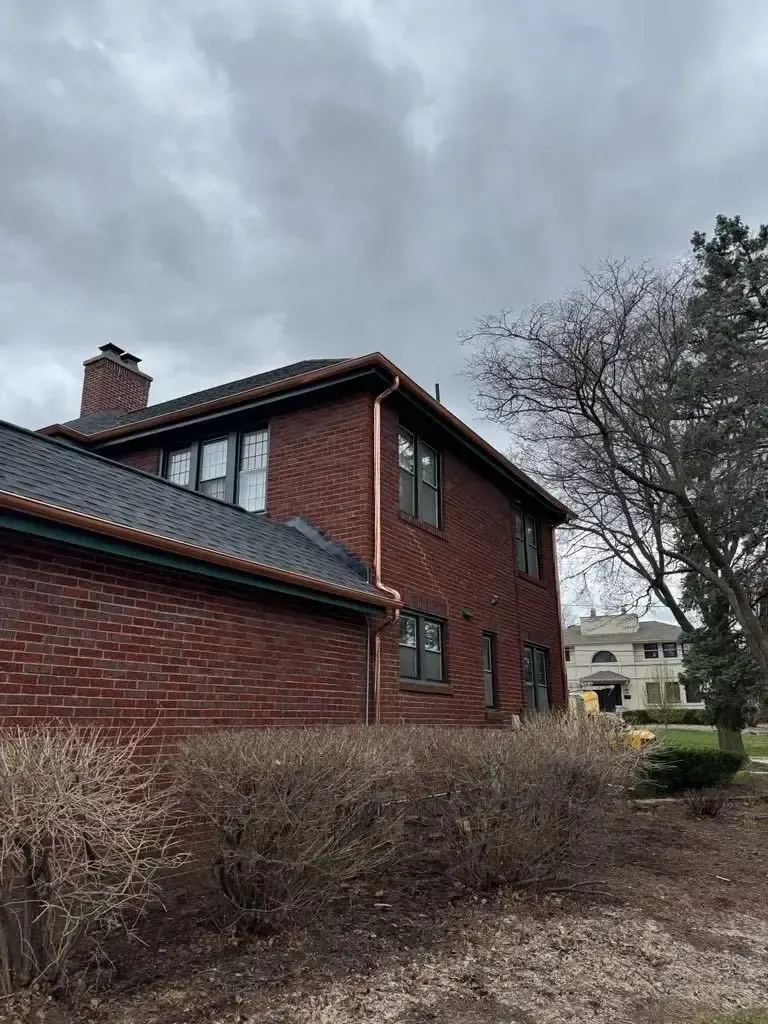 Custom half round copper gutters and twisted downspouts — Chicago, IL — photo 6