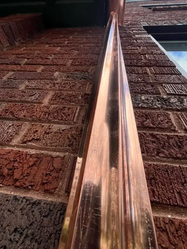 Custom half round copper gutters and twisted downspouts — Chicago, IL — photo 7