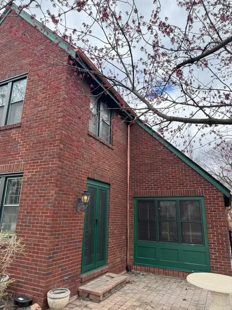 Custom half round copper gutters and twisted downspouts — Chicago, IL — photo 10