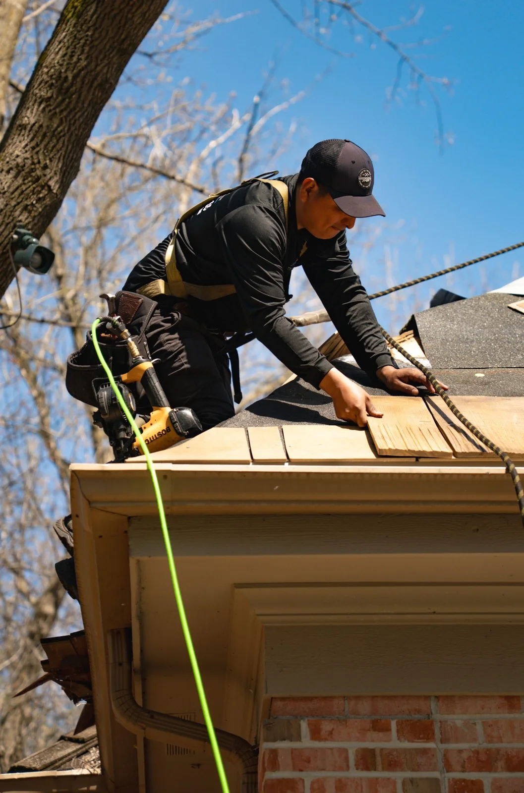 Optimal roofer installing composite shake roofing on a Chicago project