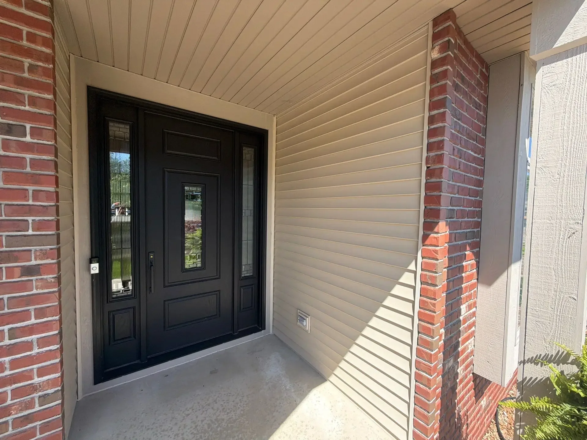 Finished soffit and exterior trim above a front entry in Schererville, Indiana
